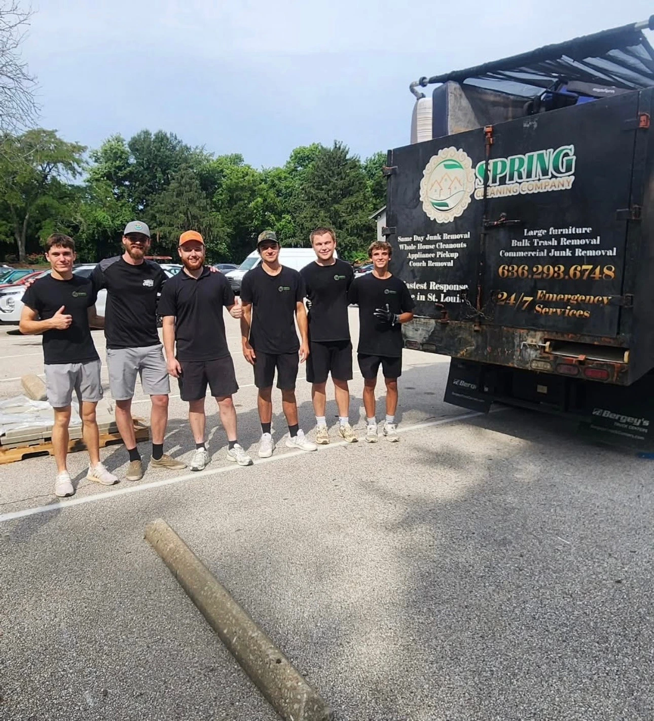 The Spring Cleaning Company crew beside their furniture removal truck in St. Charles, Missouri