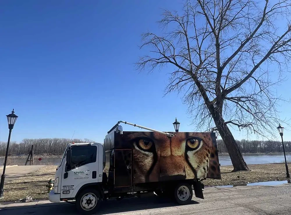 Spring Cleaning Company junk removal truck at Missouri River location providing professional services in St. Louis, Missouri