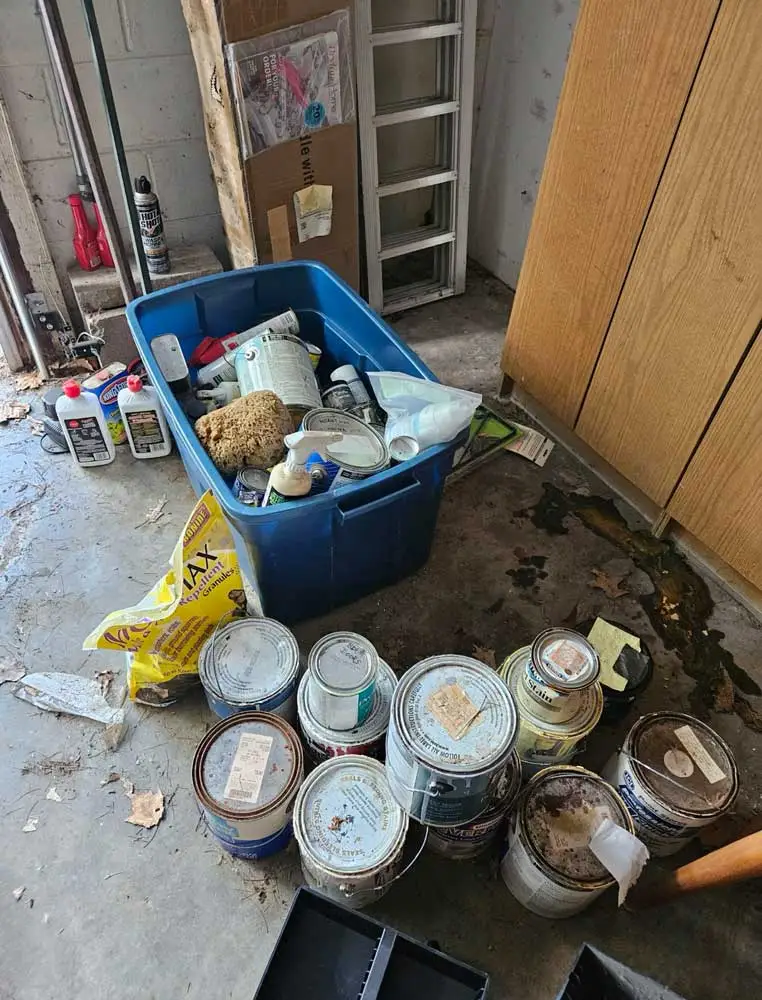 Spring Cleaning Company crew ready to pick up and dispose of old paint cans in St. Charles, Missouri