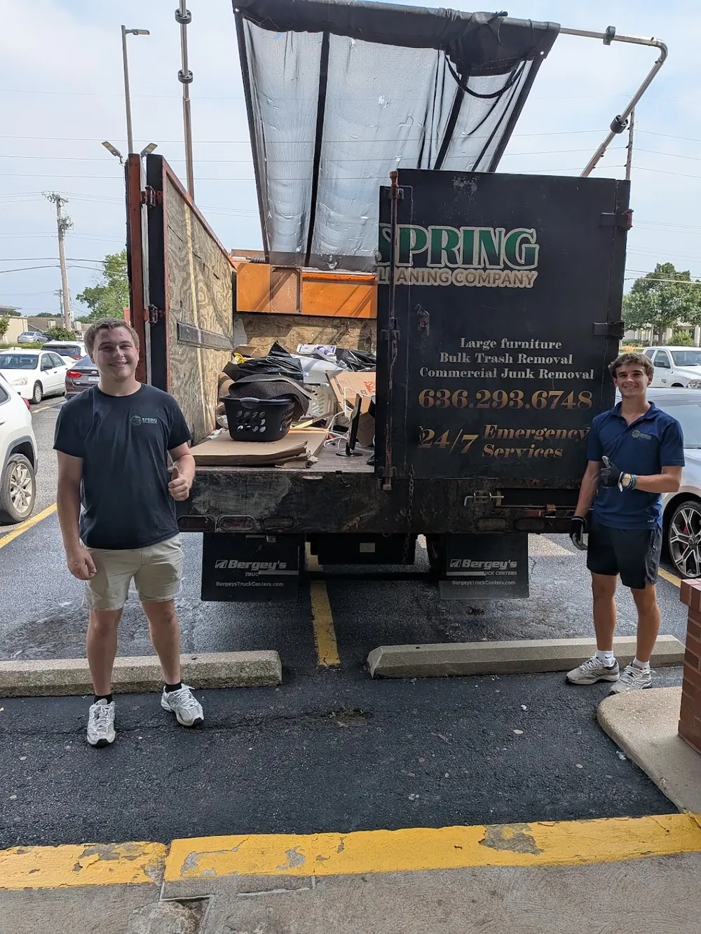 Spring Cleaning Company crew with their commercial junk removal truck outside a Missouri business