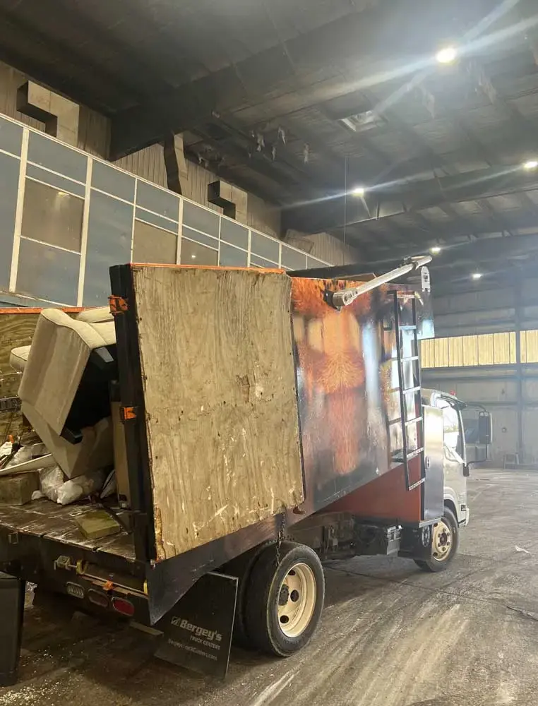 Spring Cleaning Company truck with junk loaded in back for commercial removal service in St. Louis, Missouri