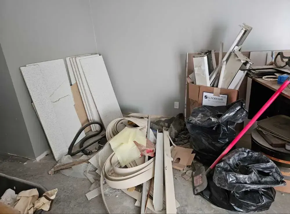 Construction supplies, drywall, and panels laying around ready for Spring Cleaning Company construction debris removal in St. Louis, Missouri