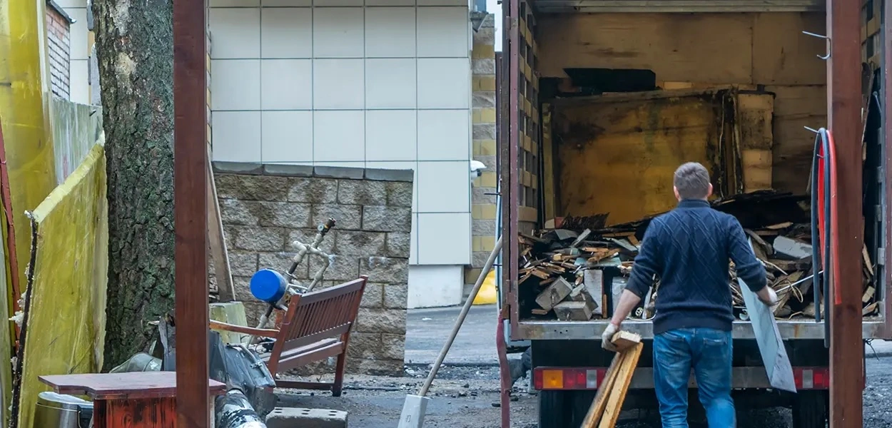Spring Cleaning Company crew loading debris into a junk removal truck in Crestwood, Missouri