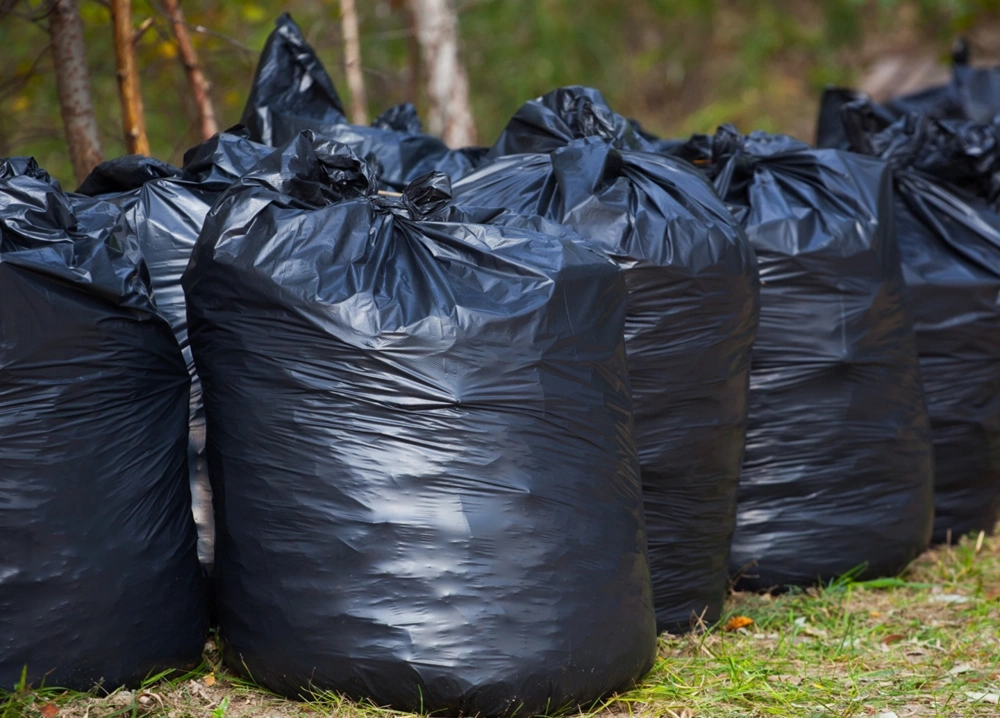 Bagged junk and household debris set out for pickup in Creve Coeur, Missouri